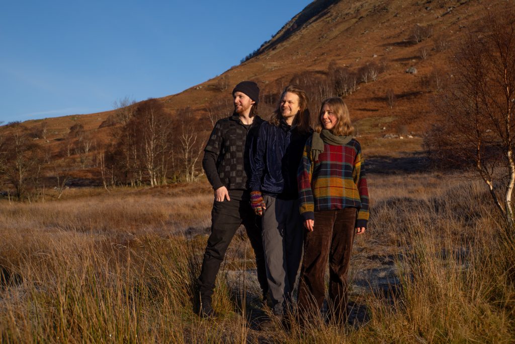 Three people in the country side